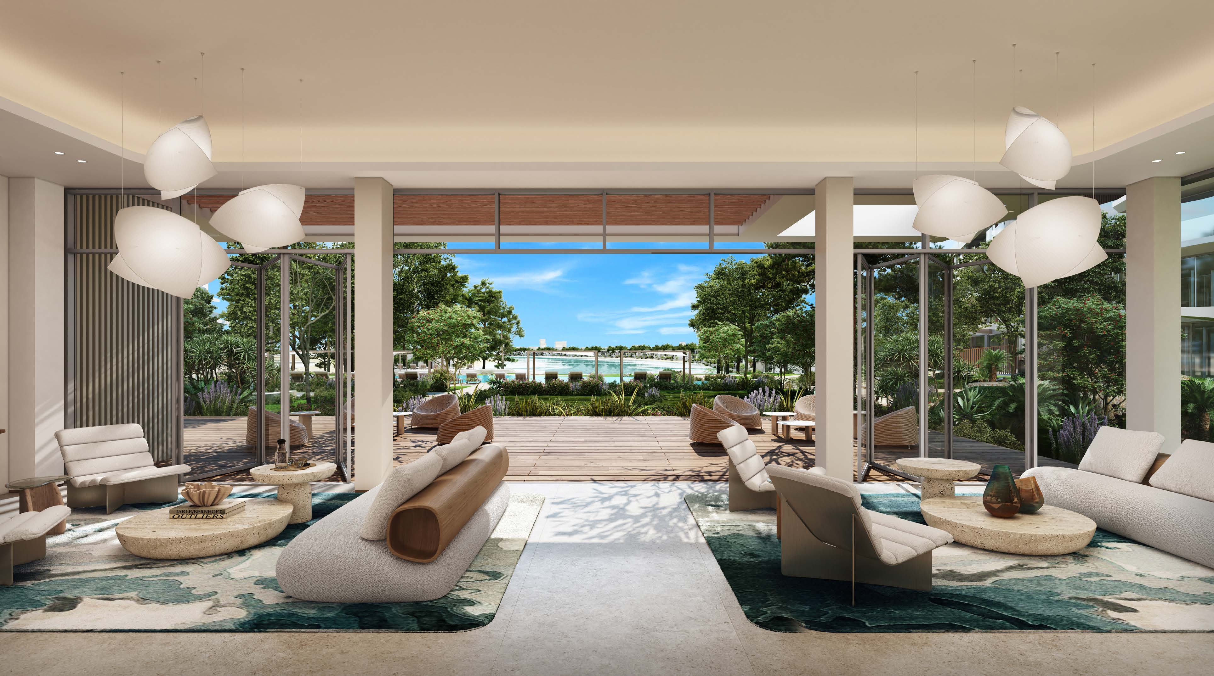 Clubhouse lounge opening onto a timber deck, gardens and the beach