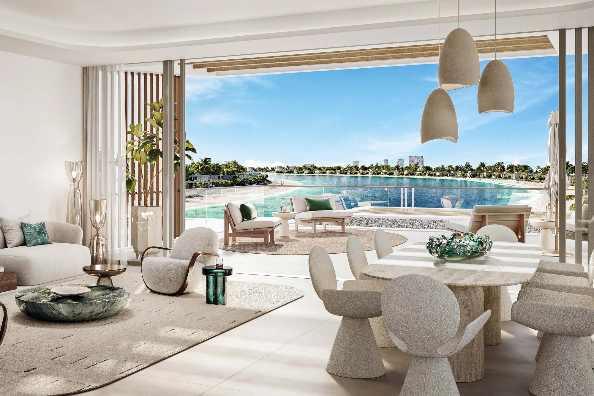 Three-bedroom living and dining room opening onto a terrace above the beach
