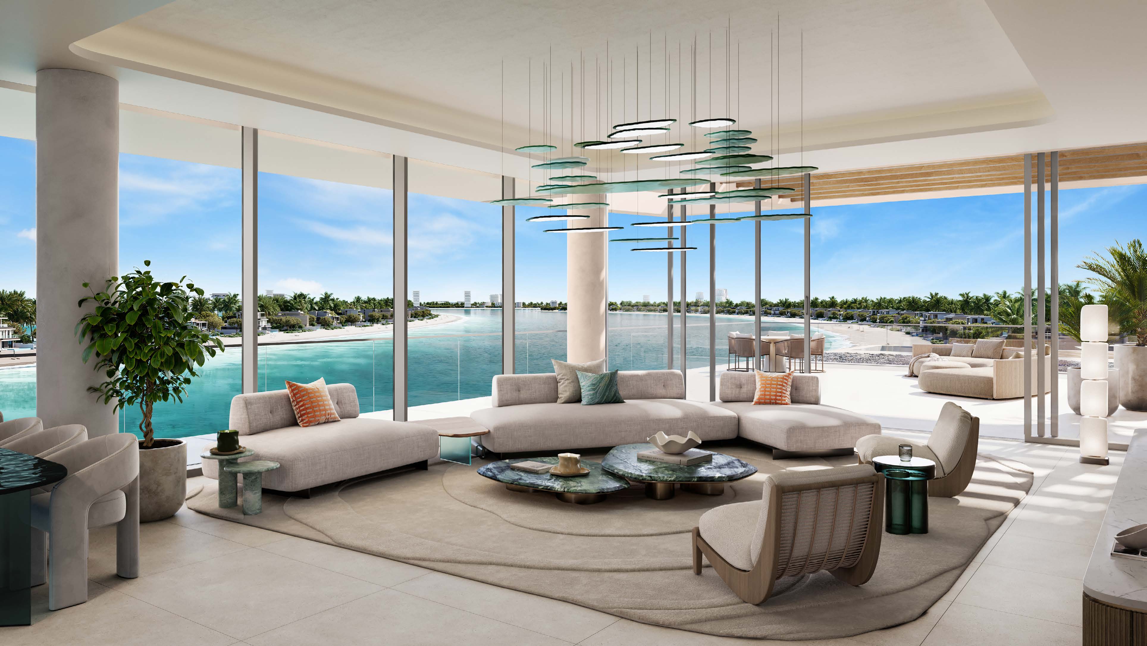 Wide four-bedroom living room wrapped in glass, with views over the bay