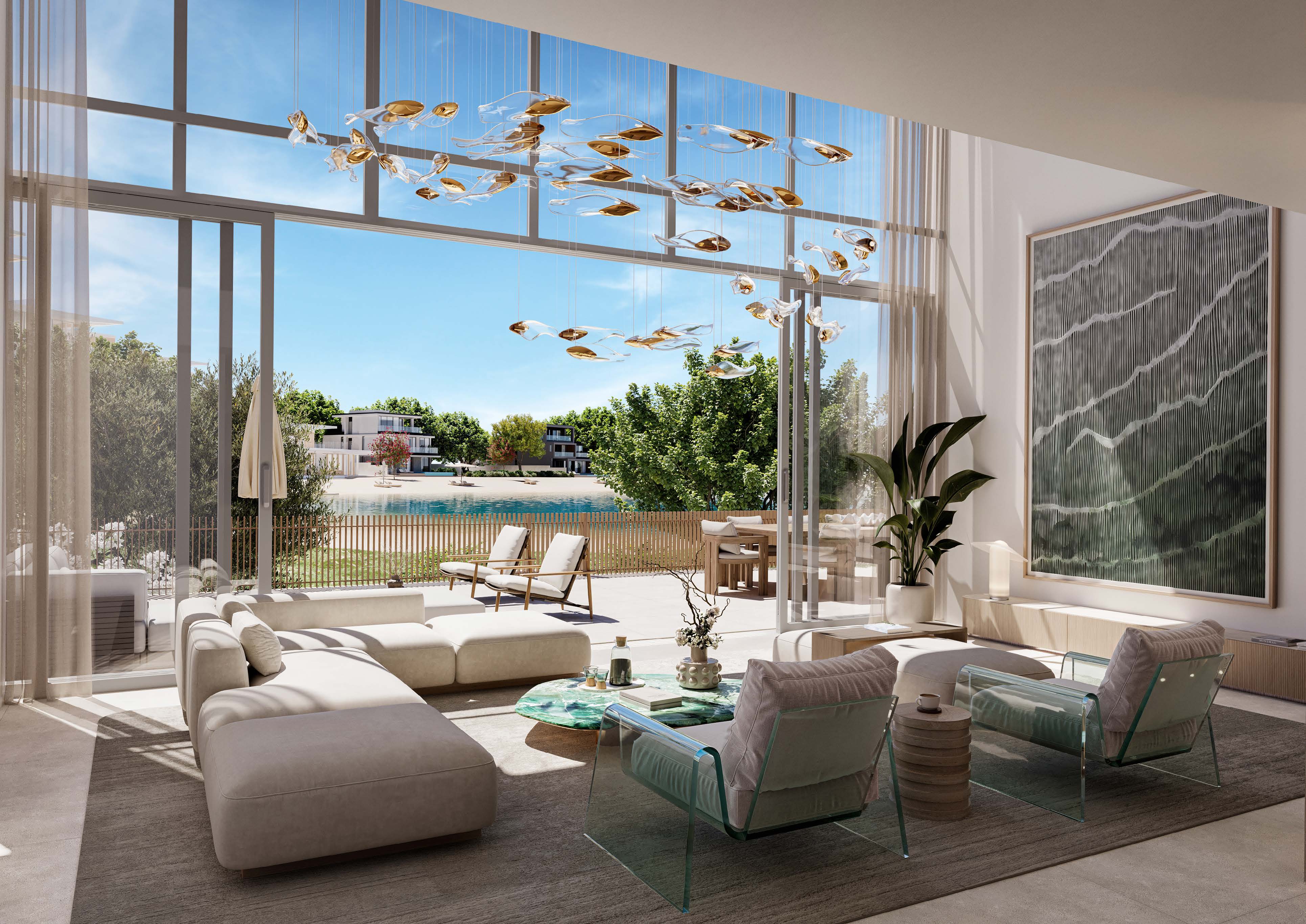 Double-height townhouse living room opening onto a terrace near the beach