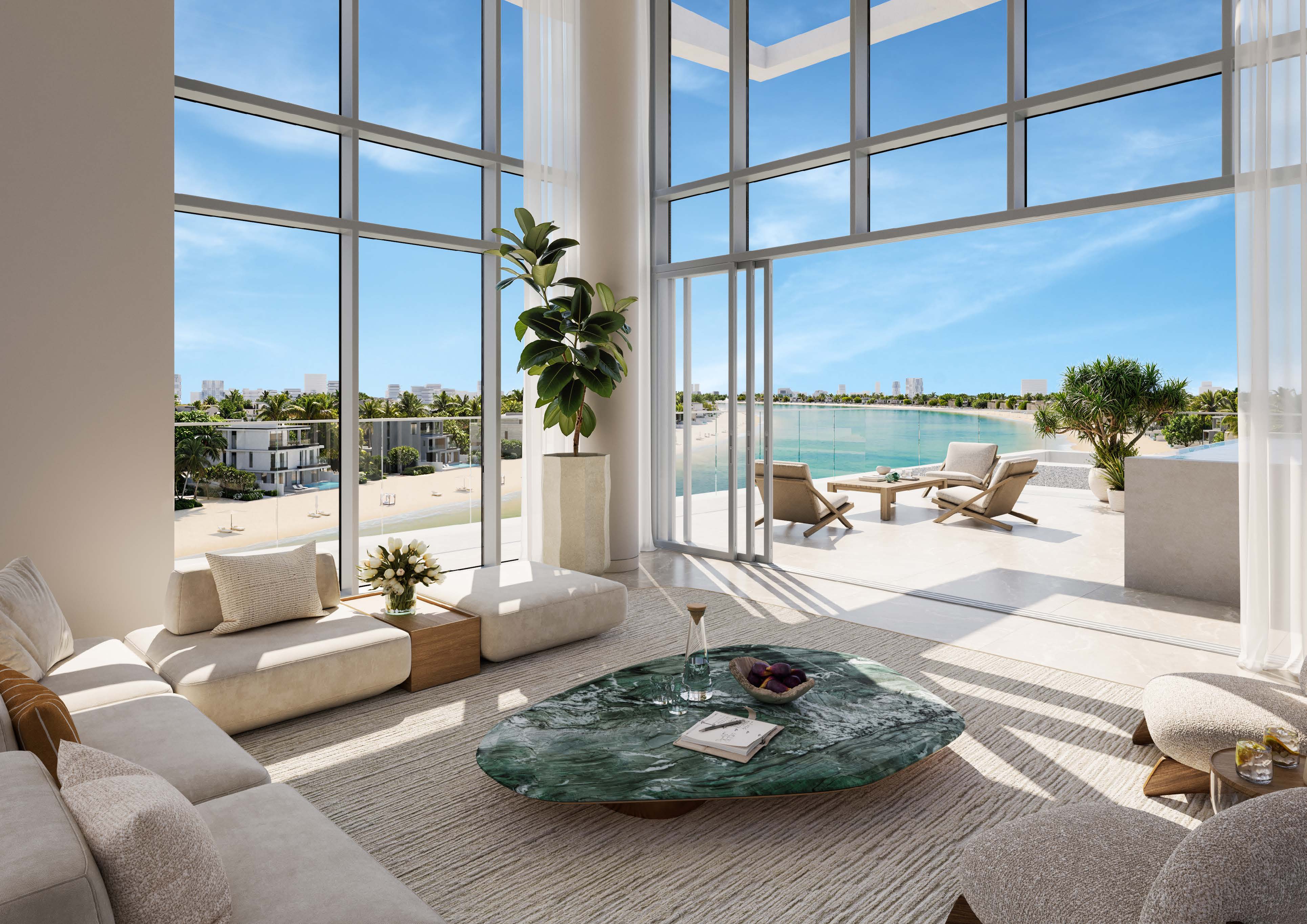 Penthouse living room with tall glazing opening onto a sea-view terrace